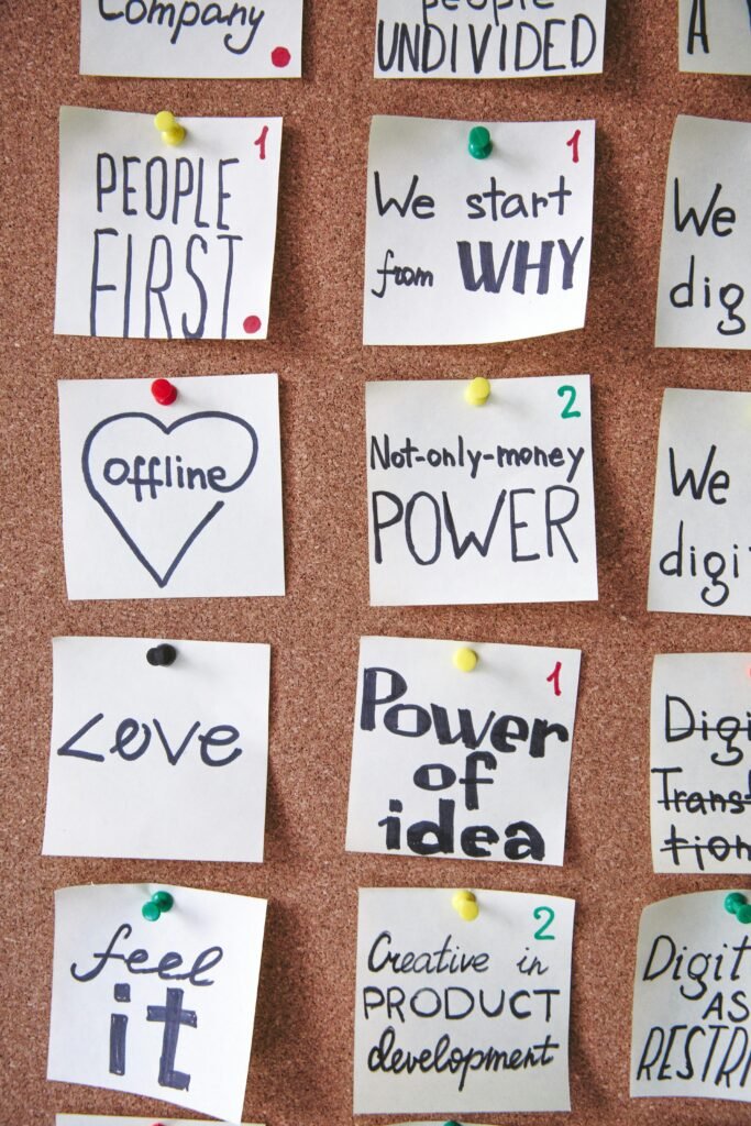 pexels-photo-3782145-3782145 A collection of motivational sticky notes with inspirational messages on a corkboard.
